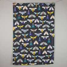 Dark moth pattern tea towel